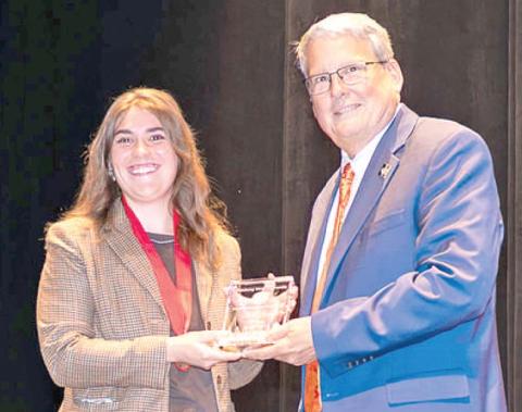 Kate Tyree, 2020 Riverton High School graduate was named Pittsburg State University student employee of the year. PSU President Thomas Newsom presented the award. Courtesy photo.