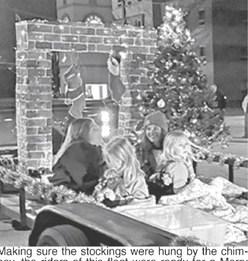 Making sure the stockings were hung by the chimney, the riders of this float were ready for a Merry Christmas at the annual Columbus Parade