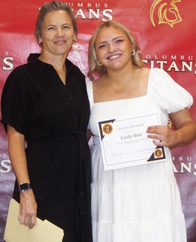Emily Britt received a Wrestling Scholarship from Ottawa University in the amount of $72,000 during the Columbus Unified High School Senior Assembly, May 16, at the CUHS Gymnasium. The scholarship was presented by Brandy Pierce, USD 493 Instructor.