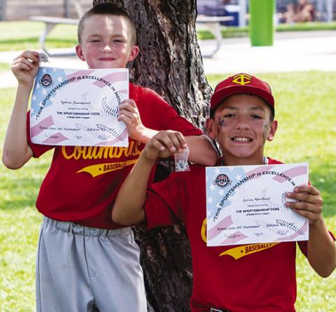 Two Columbus Cal Ripken 10U All-Stars earning their certificate and pin for memorizing the Cal Ripen/ Babe Ruth Sportsman Pledge are Kalvin Davenport and Lucas Haviland at the 10U state tournament in Hillsboro, July 16-20. The pair were also nominated for the All-Tournament Team. Photo by Kristin Sharp.