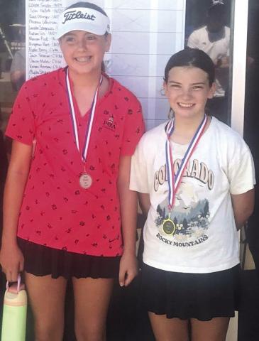 Cami Carpino placed second and Alaina Smiley took first place at the SEK Junior Golf Tournament in Independence, Thursday, in the girls 9-11 age division. Alaina edged Cami by one stroke with a sixhole total of 34 strokes. Courtesy photo.