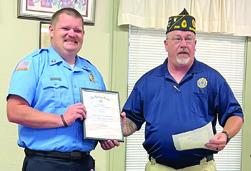 An award for Firefighter of the Year was presented to Baxter Springs Firefighter John Hunt by Baxter Springs American Legion President Daryl Nadeau at a recent meeting. Courtesy photo.