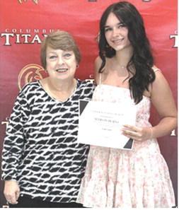 Allison Burns received the Coterie Scholarship in the amount of $250 during the CUHS Senior Assembly, May 16, from USD493 Instructor, Karen Langerot, at the Columbus High School Gymnasium.