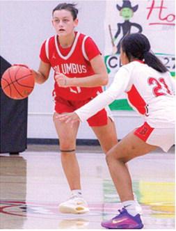Lady Titan Sophomore, Americus Woodcock, drives past Lady Lion Sophomore, Faith Murray, in the January 16, Columbus win in Baxter Springs. Americus scored six points in the Lady Titan loss to Commerce, Okla. in the 2026 Lancer Classic opening round, Monday, 26-43.