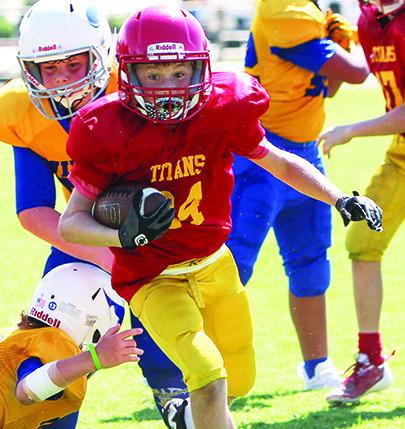 Columbus Titan Elijah Shoemaker, runs against Parsons earlier in the season. Elijah scored at TD in the shutout over Pitt-Rush, 36-0, Saturday, in Pittsburg.