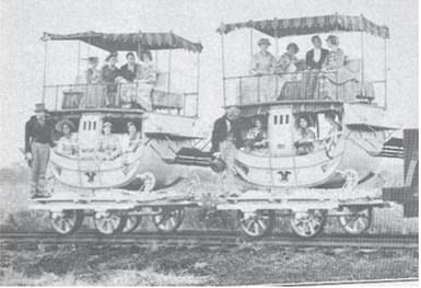 Many of the railway passenger carriages of the 1830s, bore a striking resemblance to the stagecoaches of that period. The bottom looked like a stagecoach and on top was an open-air “promenade deck” equipped with seats and awning, the last word in passenger train luxury.
