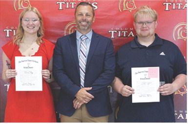 Chloe Rogers and Maddox Ochsner received the American Legion Award and Scholarship in the amount of $250 each from USD 493 Administrator, David Dainty during the 2025 Senior Assembly, May 16, at the Columbus Unified High School Gymnasium.