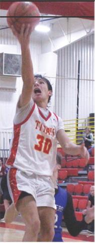 Titan Sophomore, Drake Laurance, lays in one of his multiple shots that resulted in forced turnovers by the Chargers. Drake had three consecutive layups to start the third quarter and build the Titans lead to 20 in the Tuesday win, 63-40, over Cherryvale in the CUHS Gymnasium.