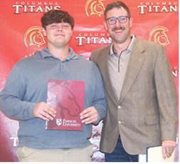 Carter Henry received three scholarships from Evangel University during the Columbus Unified High School Senior Assembly, May 16, at the CUHS Gymnasium. He received a $14,000 Academic Scholarship, a $3,000 Football Scholarship, and a $1,000 Sibling Scholarship from presenter, Matt Crain, USD 493 Instructor.