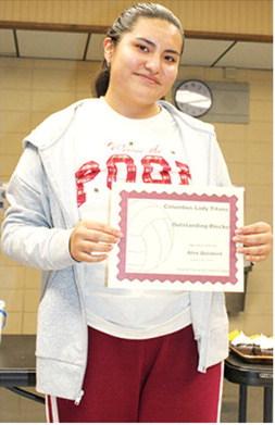 Lady Titan Senior, Alexandra Quisbert, received the award for Outstanding Blocking and Most Improved Award during the Lady Titan Volleyball end of season banquet at the Columbus Unified High School Gymnasium in October.