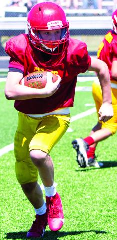 Wyatt Linn scored the lone touchdown for the Columbus Titan Fifth and Sixth Grade Team, Saturday in Frontenac. ( Photo by Kristin Sharp.)