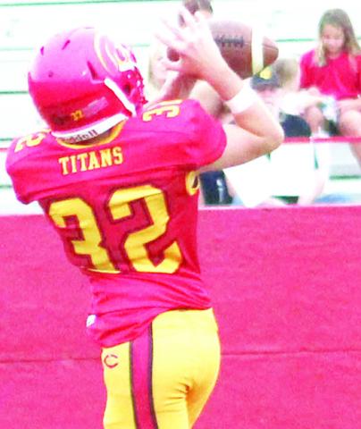 Columbus Junior High Eighth Grader, Paxton Schalk, catches a 16-yard pass from Denver Hughes for the first six Titan points in Thursday’s 46-26 loss to Riverton at Titan Stadium.