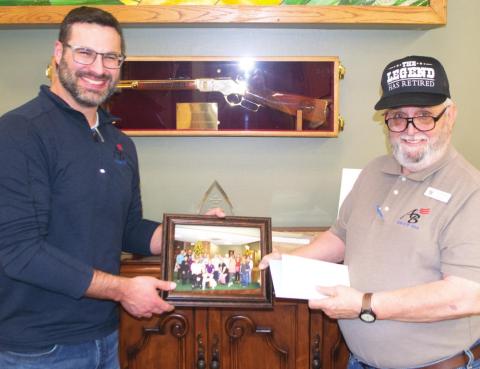 Saying farewell to a long-term employee, American Bank President Taylor Hight presented retiring teller, Dennis Webb a photo of the bank’s staff, plaques and other gifts. Webb worked in the Baxter Springs office of the bank for 20 years. The public is invited to a special retirement reception for Webb January 14 from noon-3 p.m.