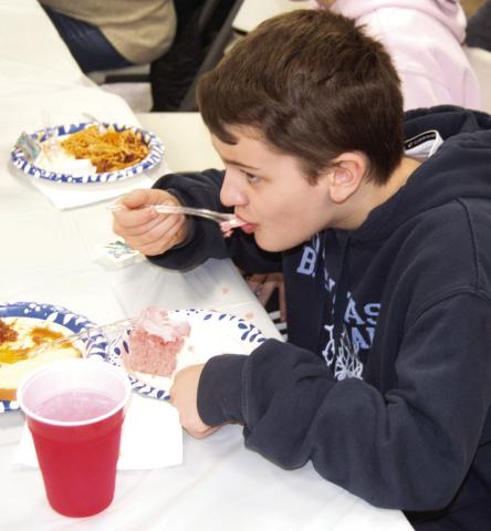 A very successful spaghetti fundraiser for Jon Tavernaro in the Weir Community Center on Saturday. Blake Sanders enjoyed a bit of cake to finish off the meal.