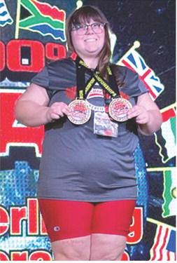 Lizzy Welch, former CUHS Lady Titan Powerlifter and current Coffeyville Red Raven Freshman, won the World Championship Title in her first powerlifting competition with the team. Courtesy photo.