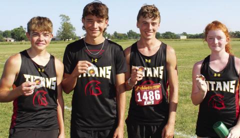 The Columbus Titan Junior Varsity Cross Country Team collected hardware, Thursday as they opened their season at the Labette County meet in Altamont. Freshmen, Easton Long, Drake Laurance, Levi Simpson and Kennedy Reichardt all raced to top 15 places in the junior varsity 5K event. Courtesy photo.