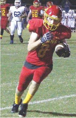 Titan Junior, Jace Midgett, makes the catch at the five yard line and scrambles into the end zone for the first Titans points of the game in the, 12-8, Columbus win over Galena, Friday.
