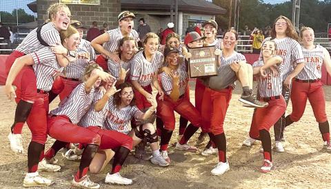 The Columbus Lady Titans celebrate after receiving their Kansas Class 3A Regional Championship plaque, Wednesday, at Rockette Field in the Columbus Community Field Ballpark. The Lady Titans are seeded third in the Kansas Class 3A State Tournament in Manhattan and will play the 7 p.m. quarterfinal game, Thursday, against Rossville (17-4), the sixth seed. The tournament is being hosted at the Twin Oaks Complex.