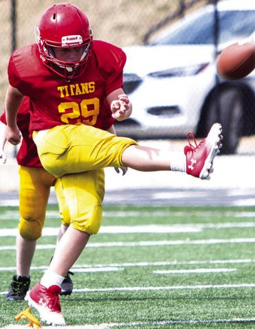 Kayden Fleshman kicked off for the Columbus Titan Fifth/Sixth Grade Titans in their win over Pittsburg Woods, 20-6, September 21, in Pittsburg. Photo by Kristin Sharp.