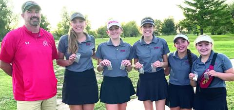 The Columbus Unified High School Lady Titan Golf Team took first place in the Uniontown Invitational, at Woodland Hills Golf Course in Fort Scott, Monday. Head Coach Dan Grundy is pictured with Anna Head, Mallory Thompson, Natalie Wary, Hannah Noel, and Amory Neely following the presentation of medals. Thompson was the top medalist to help her team slip past Caney Valley for the team win. Courtesy photo.