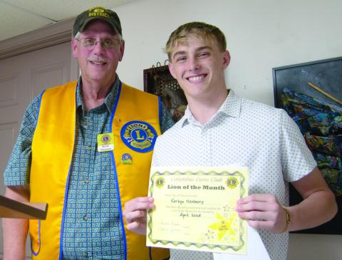 Columbus Lions Club President Brad Gleason presented Korbyn Newberry a certificate in recognition of being the Lion of the Month for April.