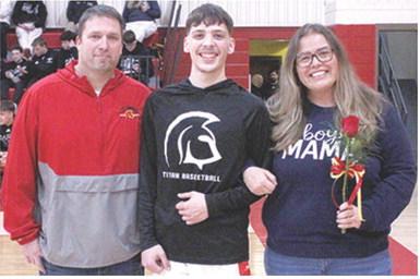 Titan Senior, Julien Basuari, was recognized during Senior Night at the Titans final home game against Frontenac, Monday night at the CUHS Gymnasium. Julien is a one year member of the Titan Basketball Team. He was escorted by his parents Justin and Misty Smith.