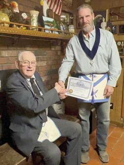 Harold Shideler received his 65 year membership pin and certificate in the AF&amp;AM lodge Tuesday, March 21. Tom Circle, Secretary of Parsons AF&amp;AM #117, presented these to Shideler at his home. There were 15 family members present for the occasion. Shideler became a member of the McCune AF&amp;AM # 232 in 1958. He transferred to Parsons when McCune closed. He filled different chairs and was Past Master twice. He remains a loyal supporter at age 94. Courtesy photo.