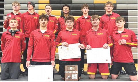 The Columbus Titan Wrestling Team captured the Kansas Class 4A Regional C Runner-up plaque in Paola, Saturday. Three Titans came away with regional champion titles and three placed third to advance to the state tournament. Members of the regional runner-up team are front row: Carlson Britt, Jayden Rodriguez, Kash Smith, Mason O’Banion, and Shade Schuberger. Back row: Chase Pelt, Cal Saporito, Denver Hughes, Kai Langerot, Wyatt Pool, and Braun Stone. Courtesy photo.