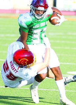 Columbus Titan 2023 Graduate, Landin Midgett, playing for the East Team brings down a West player during the 50th Annual Kansas Shrine Bowl All-Star Game, Saturday, in Hays. The West Squad held off a late charge by the East Team to take the win, 2120, late in the fourth quarter. Photo by Rick Peterson Jr./KSHSAA Covered.