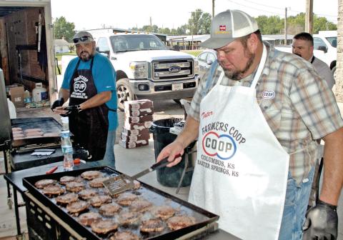 Farmers Co-op employees were busy frying hamburgers to fill the bags in recognition of the first responders in Cherokee County. Chefs Josh Green, Mike Soper and Matt Case fried more than a hundred burgers for the event