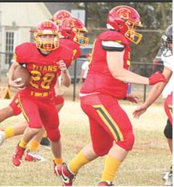Titan Freshman, Brody Carter, scored two touchdowns including a kickoff return for a touchdown to start the second half to put the home team on top, 12-7, in the 30-21, Columbus win at Titan Stadium, Monday.