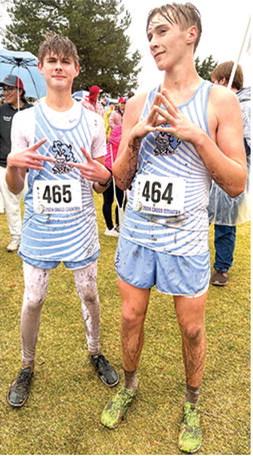 Tucker Sutton, freshman, and Zane Gabern, were a little worse for the wear after finishing the Kansas Class 2A State Cross Country 5K Race, Saturday, at Rim Rock Ranch in Lawrence. Courtesy photo.
