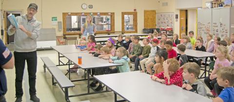 Park Elementary kindergarteners enjoy some afternoon reading time with Fire Chief, Steven Burton. Chief Burton read, “If You Give A Dog A Donut”, to kindergarten students during their readathon week celebrating Dr. Suess’ birthday. News Report photo by Tanya Woolsey.