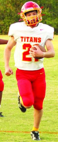 Titan Freshman, Shade Schuberger, crosses the goal line for the two-point conversion minutes after his receiving touchdown from sophomore quarterback, Ethan Midgett. Columbus came up short, 1620, in Baxter Springs, Monday.
