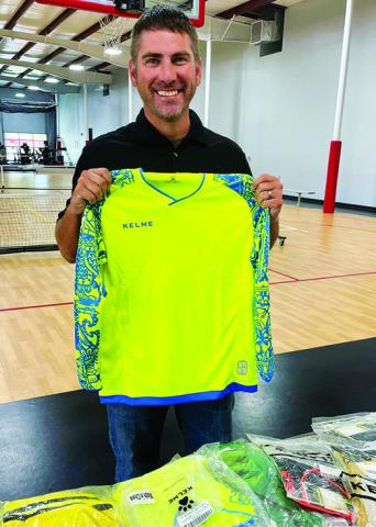 Brandon Rowton delivers youth soccer goalie jerseys to the Columbus Area Youth Soccer Program. Rowton and wife, Carly Hill Rowton, both products of the organization, donated multiple sizes, replacing some league jerseys as old as 27 years. Courtesy Photo.
