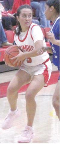 Lady Titan Senior, Brylie Johnson, looks off St. Mary’s-Colgan Junior, Jakayla Davis as she brings the ball down during the Friday, home opener loss, 26-72, at the CUHS Gymnasium.