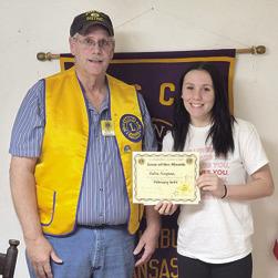 Brad Gleason presented February Lion of the Month Katie Simpson with her certificate at a recent meeting. Courtesy photo.