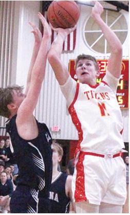 Titan Sophomore, Jonas Stover, goes up for the goahead basket with 1:32 on the game clock. Jonas made the and-one free throw for a two-point, 47-45, lead in the 50-47 win over Galena, Thursday at the CUHS Gymnasium.