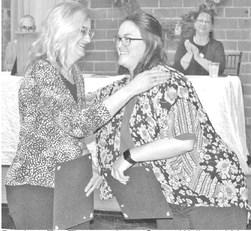 Previous Top Titan nominees Susan Wells and Mattea Cupp. Wells was named the winner.