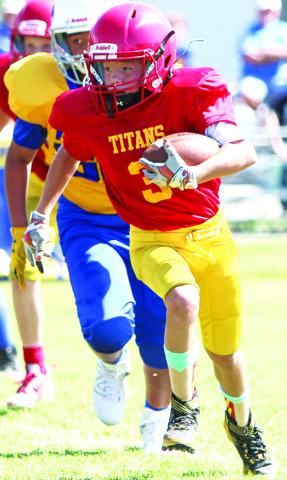 Cam Carter was a workhorse for the Titan Fifth and Sixth Grade Team in their 30-6 rout of the Parsons Vikings, Saturday at Titan Stadium. Photo by Kristin Sharp.