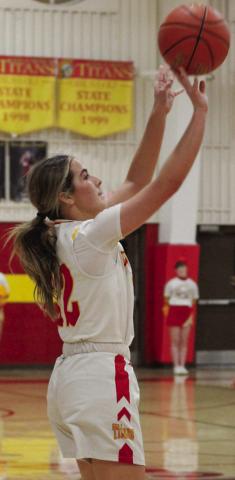 Lady Titan Senior, Ava Harman, shots from the threepoint line in the 59-40 win over College Heights in the MOKAN Tournament, Friday, at the CUHS Gym.