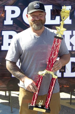 Cookin-N-Khakis represented by Nate Long was the overall champion in the Columbus Day Police, Pork and Pride barbecue competition. Long placed first in Chicken, Ribs and Pork.