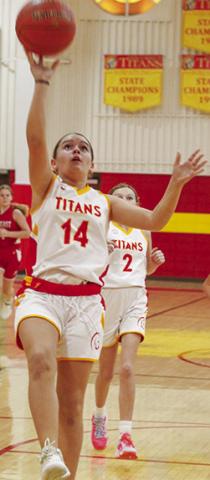 Columbus Lady Titan, Annabell Baker, drives in for a layup in the Saturday, Jamboree, hosted at the Columbus Unified High School Gym. Laklynn Carter trails for the rebound.