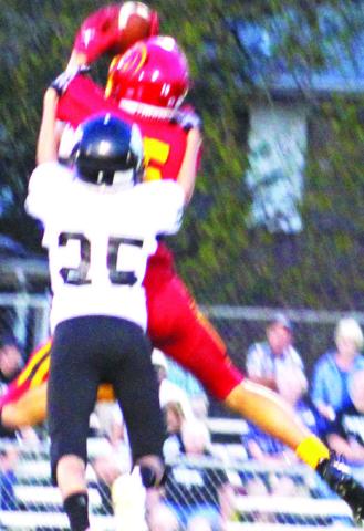 Titan Freshman, Kooper Saiz, comes down with a catch against the Frontenac Junior Varsity, Monday, at Titan Stadium. The Raiders took the win, 20-0.
