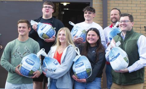 Trent Smith, Lexy Stone, Kate Zahm, Congressman Jake LaTurner, Jonathan Hodgson, Jaxson Haraughty and Jerry Smiley