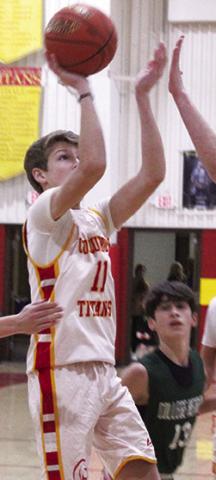 Jonas Stover scored six points including this jumper in the 8A, 18-55, season opening, loss to College Heights Christian School, Tuesday, at the Columbus High School Gym.