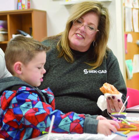 Maddox Grant enjoyed a visit with Jamie Ball at Park Elementary recently for their Books and Breakfast event. Friends, family members and older students read a book or two and had breakfast at the event. Courtesy photo.