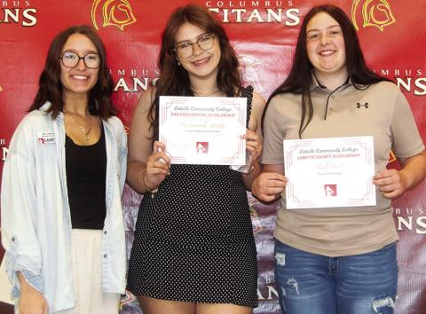 Savannah Beaty received a Cardinal Scholarship for $300 and the Cardinal Academic Scholarship in the amount of $4,176 from Labette County Community College during the Senior Assembly, May 16, at the CUHS Gym. Kadi Cobb received a Labette County Scholarship for $3,904. The scholarships were presented by Mia Howard, LCC Representative .