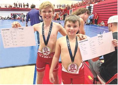 Columbus Titan Mini Wrestlers Lucas Natalini and Barrett Bowin took first place at the Seneca, Mo. Wrestling Tournament, Sunday. Courtesy photo.