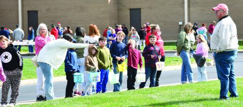 Each year the Baxter Springs Kiwanis Club Easter egg hunt draws a large crowd. Many youngsters waited for the race to the eggs to begin. The hunt was held Saturday at Baxter Springs High School.